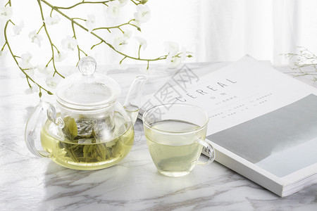 毛尖绿茶绿茶与玻璃茶壶背景