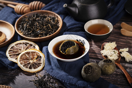 黑陶茶壶茶叶与茶具背景