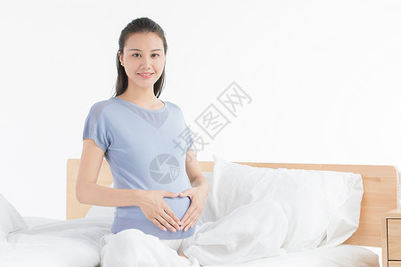 孕妇休息孕妇坐床上休息背景
