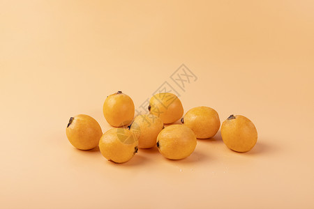 新鲜枇杷水果背景背景图片