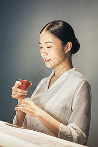 女茶艺师品茶背景图片