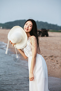 戴帽子的女生海边人像背景