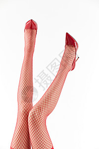 女性穿着红色丝袜和红色高跟鞋俯拍特写图片