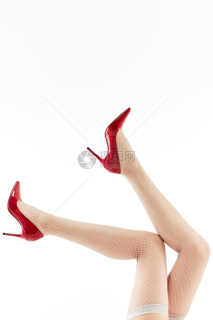 女性穿着白色丝袜和红色高跟鞋特写图片