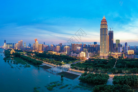 夕阳晚霞下的城市地标建筑夜景建筑群高清图片素材