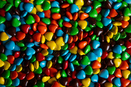 彩色拼接爱心彩色巧克力糖果背景