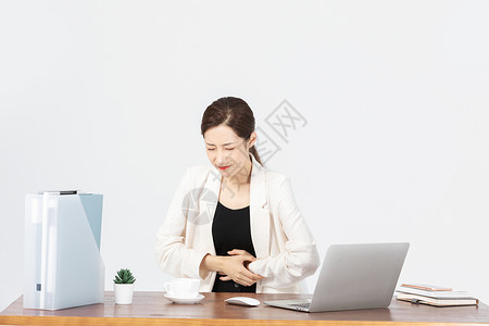 办公桌前身体不舒服的商务女性模特高清图片素材