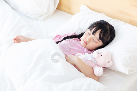孩子在睡觉小女孩在床上睡觉背景