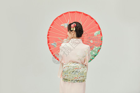 日本雨伞和服美女打着红色油纸伞背景