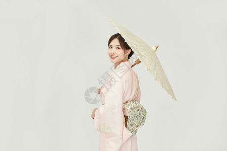 日本雨伞和服女孩撑油纸伞回眸背景