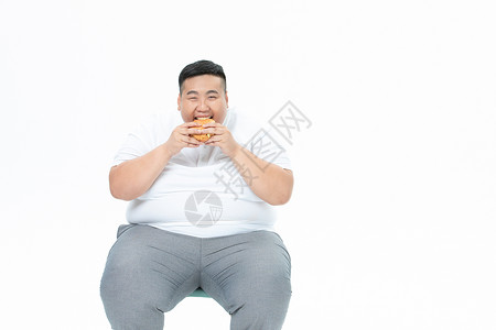 吃东西的胖子青年男性胖子吃汉堡背景