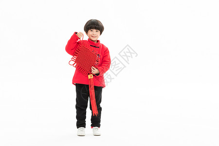 新年小男孩手拿中国节背景图片