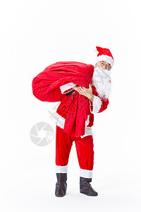 圣诞老人背着礼物袋背景图片