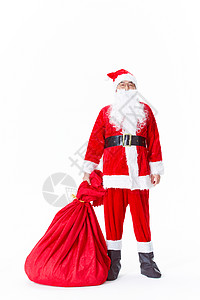 圣诞老人拖着一袋子礼物背景图片
