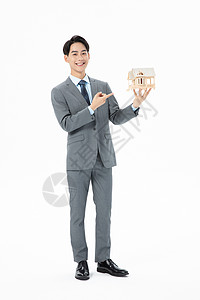 青年商务男性抱着房子模型办公高清图片素材