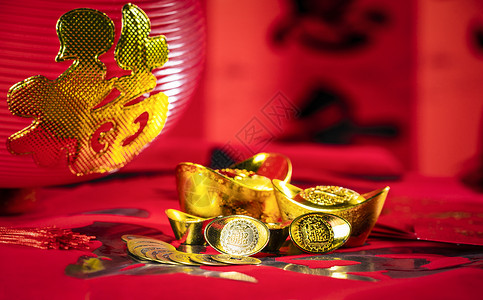 新春春节金色元宝红包静物背景图片