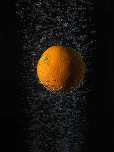 橙色气泡，黑色背景图片