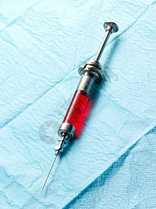 红色液体注射器背景图片