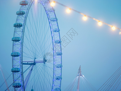 蓝天下的伦敦眼摩天轮背景图片