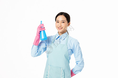 塑胶手套家政服务女性使用洒水器背景