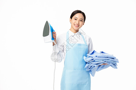 熨烫机元素家政服务女性熨烫衣服背景
