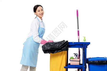 保洁员推着清洁推车背景图片