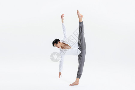 男性舞者民族舞蹈动作劈腿背景图片
