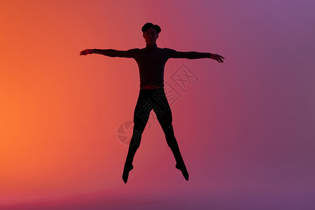 男性舞蹈动作跳跃剪影背景图片