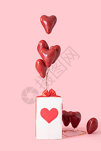 气球礼物盒粉色背景下的情人节礼物盒背景