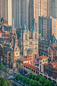武汉光谷城市高楼大厦包围中的古建筑教堂群建筑群高清图片素材