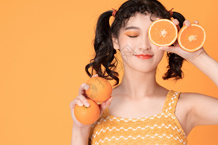 甜美少女与橙子背景图片