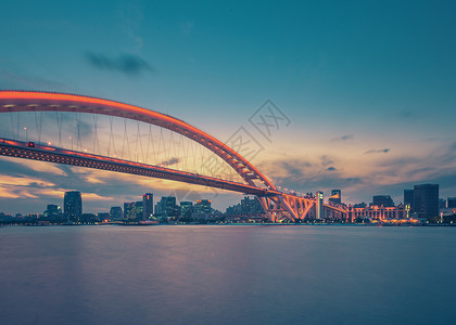 行走江湖上海卢浦大桥夕阳夜景背景