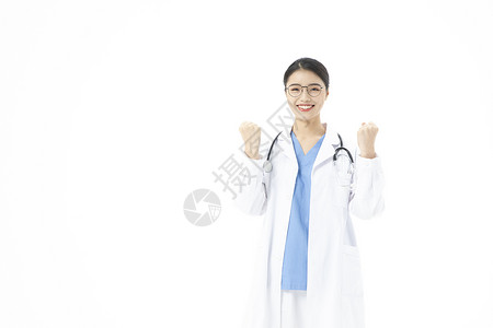 女性医生戴着听诊器加油手势图片