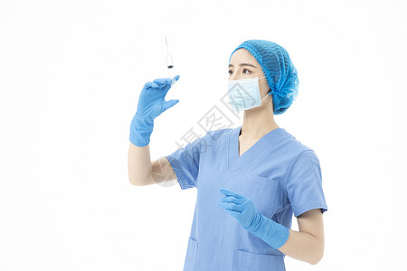 女性医生手术服拿着针筒打针高清图片