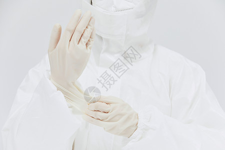 白色手套穿防护服戴医用手套特写背景