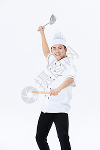 手握擀面杖的厨师图片