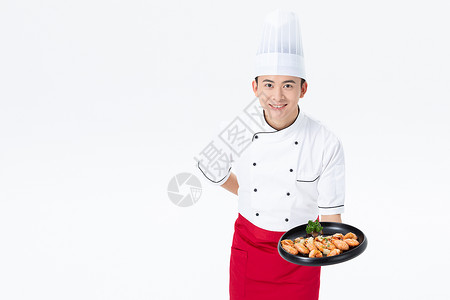 厨师手捧基围虾菜品图片