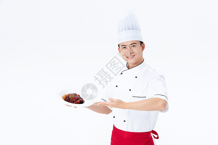 厨师手捧红烧肉菜品图片