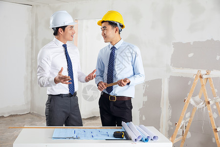 建筑项目设计图装修工程师讨论设计施工图纸背景