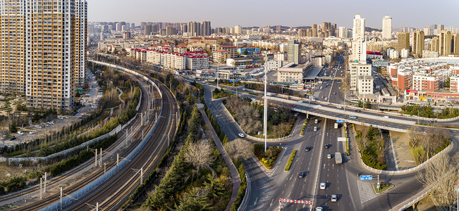 青岛新冠高架城市立交桥繁忙的城市交通背景图片