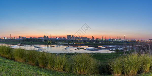 工业风景西咸新区渭河湿地工业区日落背景