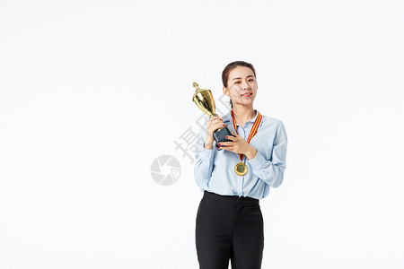 商务女性拿金牌青年商务女性获奖欢呼背景