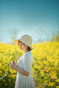 油菜花春游美女人像高清图片