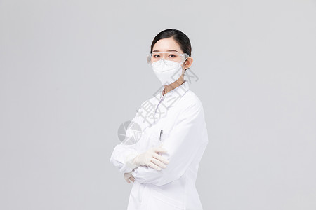 防护与保护佩戴口罩与护目镜的女医生背景