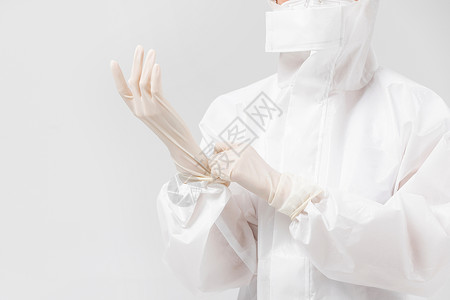 白色防护服穿着防护服的医护人员戴手套背景