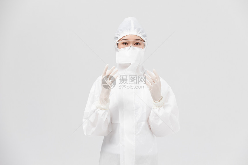 穿着防护服的医护人员戴手套图片