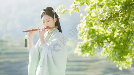 古风美女汉服古装美女吹竹笛短笛背景