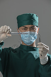 男性手术服医生拿着手术剪刀医疗高清图片素材