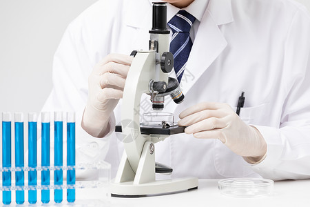 生物显微镜试管实验的男性科研人员背景