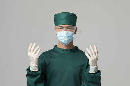 男性手术服医生防疫戴手套背景图片